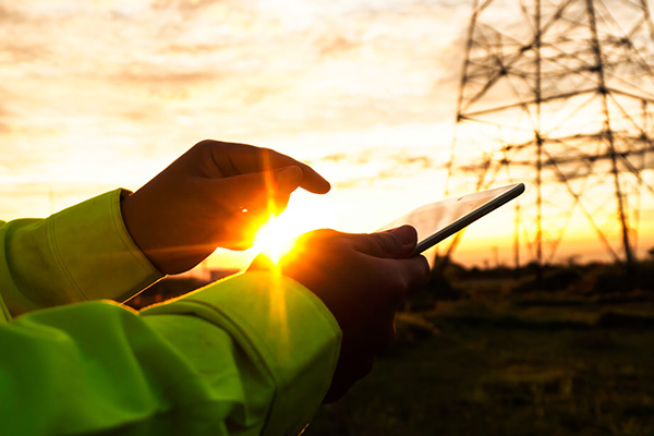Electrical Worker looking at tablet